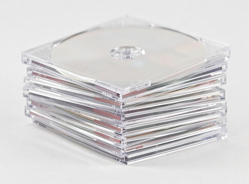 A pile of compact discs stacked on top of each other