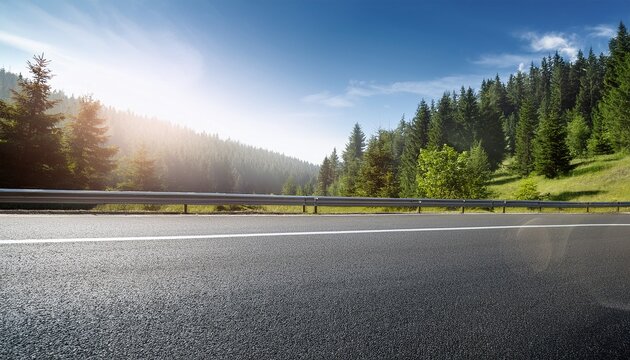 side view of asphalt road with forest