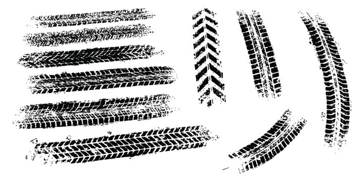Set of black tire tracks and wheel marks from different vehicles on the road