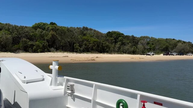 FPV onboard view of 4WD vehicle boarding car ferry from Inskip Point to K'gari Fraser Island, Queensland, Australia. Popular off-road destination, tropical coast adventure travel.