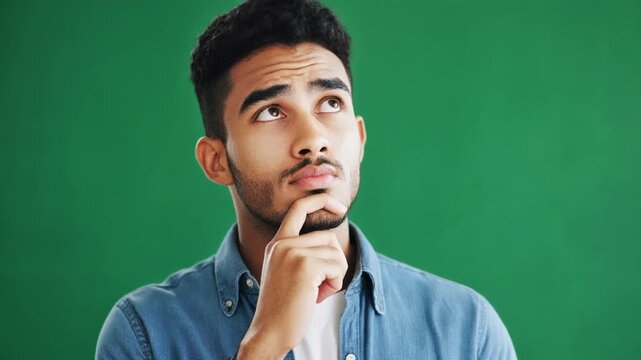 Close-Up of a Thoughtful Young Man Pondering an Idea During a Project Brainstorming Session