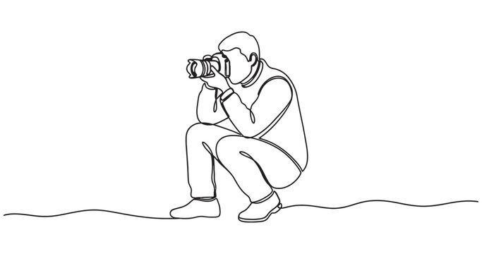 Continuous single line drawing of male photographer crouching down while holding camera for professional photography session World Photography Day