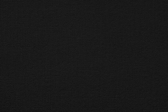 Black canvas or paper texture with a fine, uniform grain. Deep, rich tones create a striking contrast. Ideal for minimalist or luxurious design projects, this any creative