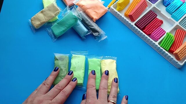 Hands are sorting plasticine - preparation for the creative process