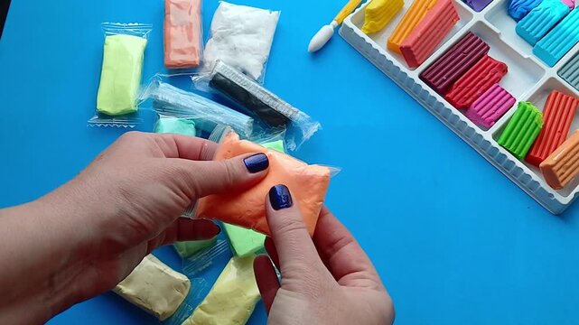Hands are sorting plasticine - preparation for the creative process