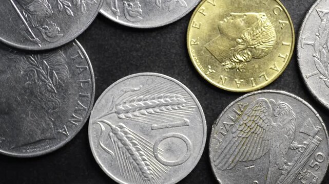Old Italian coins and banknotes rotating &ndash; vintage money, European currency and economy concept