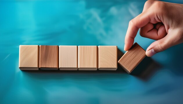 hand placing last wooden block in progress bar indicating next step