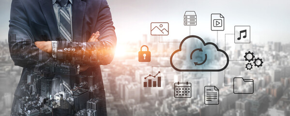 A businessman in a suit stands against a city backdrop, surrounded by cloud computing icons symbolizing data management, security, and digital solutions for modern enterprises. Gantry © InfiniteFlow