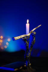 Fototapeta premium Magic wand on a stand near a candle