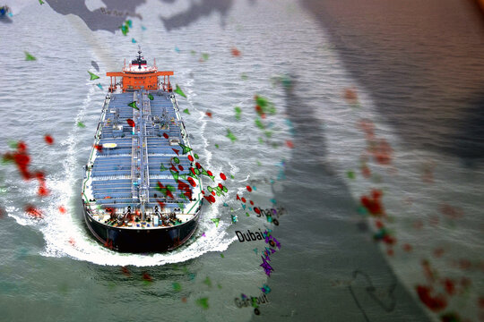 Oil tanker navigating the Strait of Hormuz with maritime traffic overlay