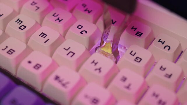 Careful process to restore old keycaps using epoxy glue. Restoration of antique keycaps involving detailed use of epoxy glue and precise tools for perfect fixing