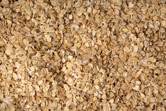 Oat flakes textured pattern, rolled oatmeal macro background