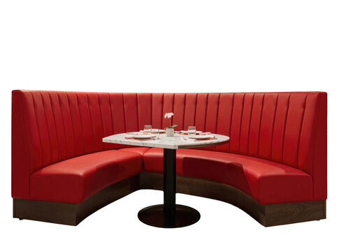 Cozy dining space with a corner booth featuring a table and chairs