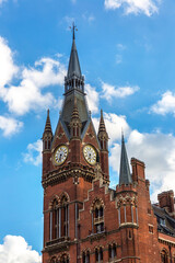Obraz premium St Pancras international railway station clock tower in London in a summer day, England, UK