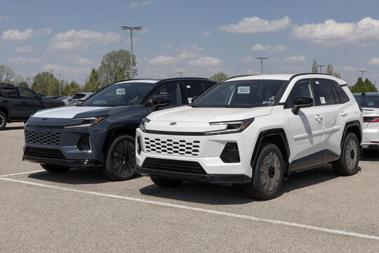 Toyota RAV4 Plug-In Hybrid AWD SUV at a dealership. Toyota offers the RAV4 with a 2.4L 4-Cylinder Hybrid engine. MY:2026