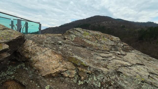 Rocky cliff overlooks deep valley below.  Vucjanka Canyon, Serbia.