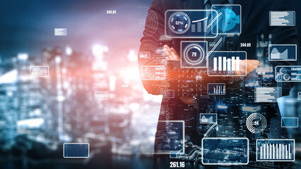 A business professional stands confidently, analyzing data insights with various digital graphs overlaying a vibrant cityscape at night, symbolizing modern analytics and business strategy. Xenic © InfiniteFlow