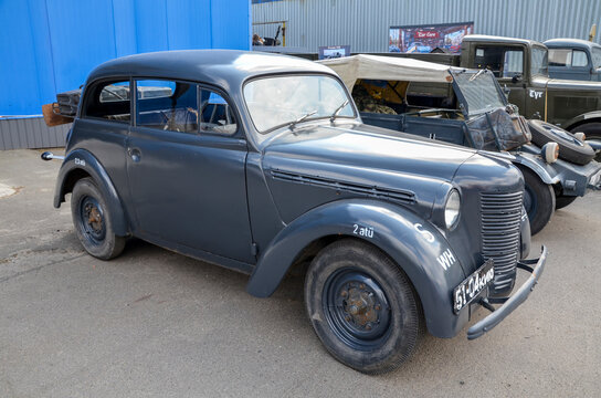 Matte grey Opel Kadett K38, stands as a rare piece of automotive history. Its rounded fenders and vintage grill represent a significant era of 1930s European design