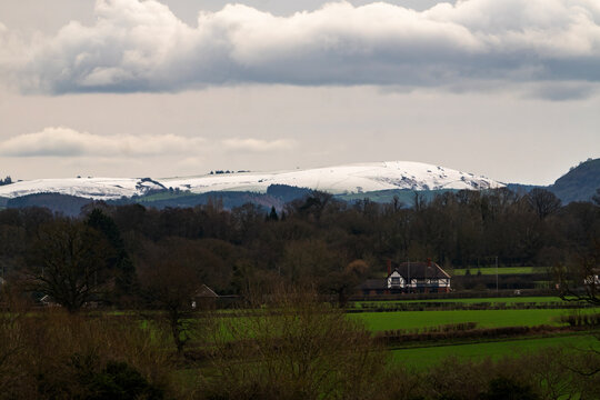 Winter&rsquo;s Edge: Snow-Capped Shropshire Hills Viewed from Wrexham