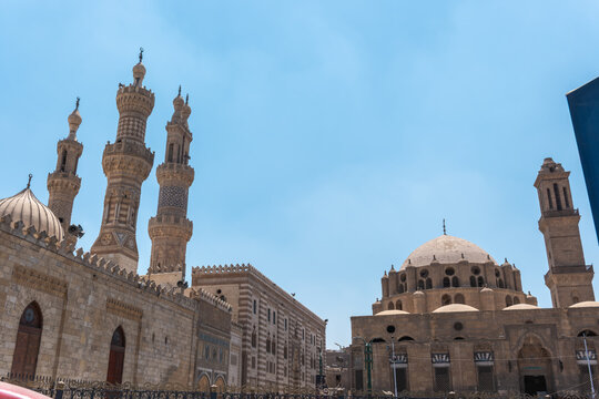 View of Al-Azhar and Abu Al-Dahab Mosques under a clear blue sky in El-Darb El-Ahmar, Cairo Governorate, Egypt.