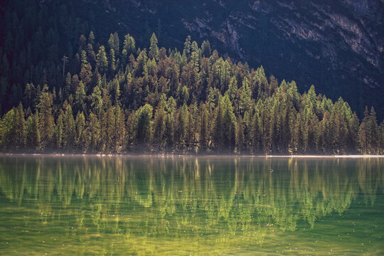 Peaceful picturesque mesmerizing atmospheric landscape at mountain lake with on summer day with blue sky and clouds mirrow reflected in lake water
