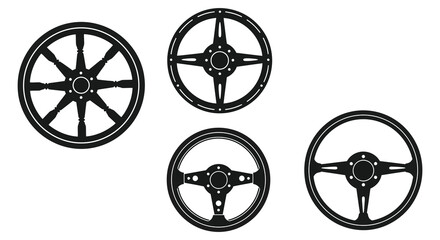 Four vintage steering wheels displayed in a striking black silhouette © mst