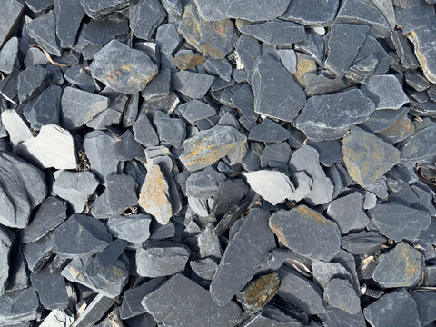 Dark slate rock fragments pile