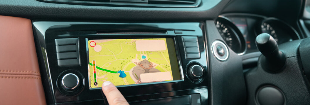 Modern vehicle parking with multiple camera sensors activated on dashboard display, demonstrating driver assistance technology helping maneuver and park safely.