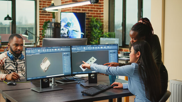 Creative agency diverse team editing video footage using color grading and visual graphic timeline. Professional editor experts working with media footage production in office workspace.