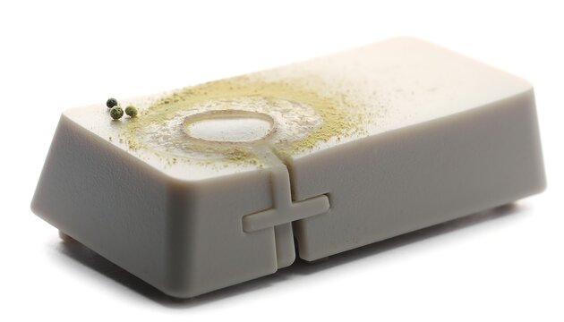 Conceptual Keyboard Key with Natural Moss and Dust Texture on White Background