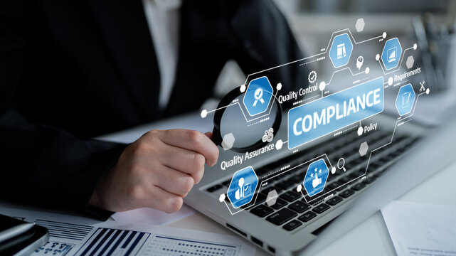 A business professional analyzes compliance strategies using a laptop. Focus on quality control, assurance, and policy management in a corporate environment. Tessel