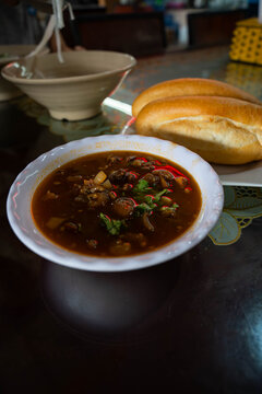  a traditional Vietnamese Beef Stew with Red Wine also known as B&aacute;nh M&igrave; Sốt Vang served with baguette