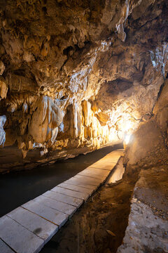 captures the mysterious and grand interior of a wet limestone inside mermaid cave at Thung Nham