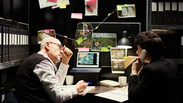 Partners receiving suspect whereabouts, running to catch culprit at secret location. Police officers finding gps coordinates on landline phone call, uncover new case information.