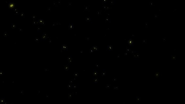 Abstract yellow light particles slowly float and shimmer in dark space as atmospheric dust or embers