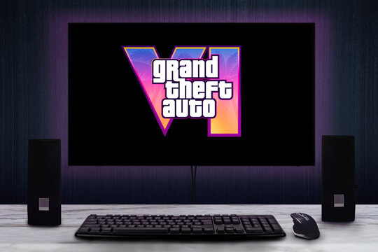 Cali, Colombia - December 5, 2023: Grand Theft Auto VI (6) video game logo on PC screen with keyboard, mouse and speakers.