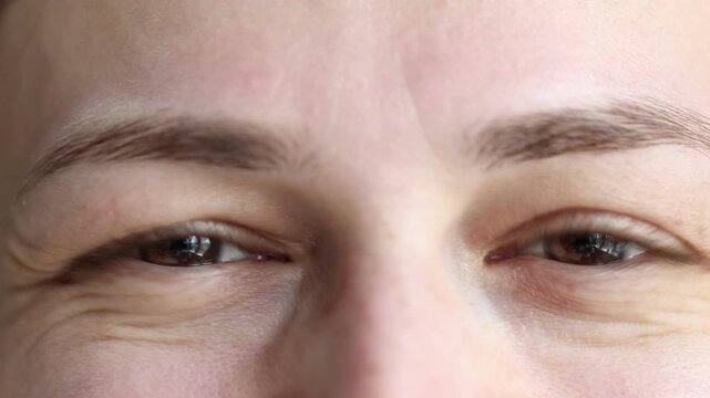 Macro view of woman with beautiful brown eyes