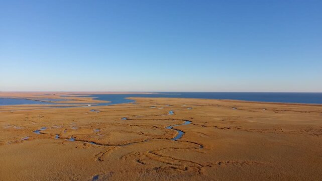 Drone clip of slow ascension over the intercostal waterway in South Carolina just before sunset.