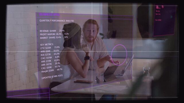Pair leaning over laptop raising purple overlay dot pointing reviewing work metrics as team passing