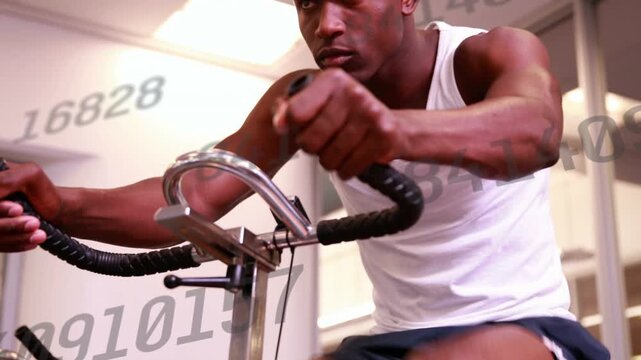 Man pedaling in fitness gym, starting pedal and showing metrics tracking pace as camera rising