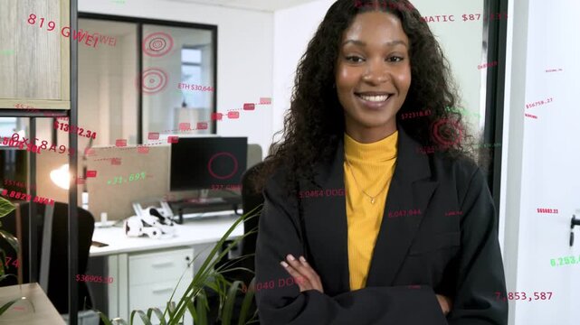 Woman by door red green data appearing around her crossing arms smiling showing business insight