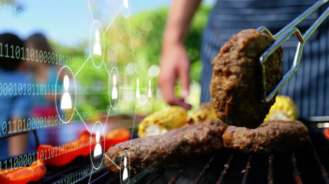 Cook flipping burgers on grill with tongs, checking doneness for meal, tech overlay over left side