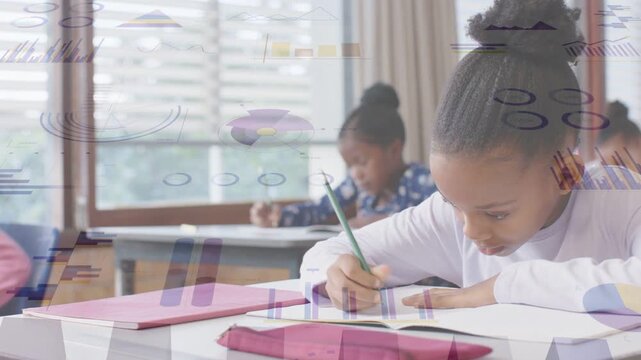 Girl leaning over notebook, writing with green pencil doing classwork as charts overlaying desks