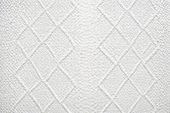 Elegant white snakeskin texture with a diamond pattern and central scale detail