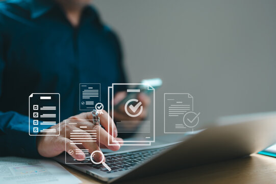 Businessman manages digital documents laptop smartphone sitting wooden desk where virtual icons represent electronic signatures automated workflow management modern office setting indoor workspace.