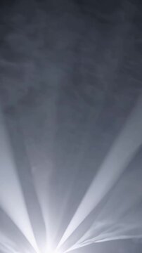 Bright lights illuminate, Spotlights pierce foggy darkness intensely, Stage lighting creates dramatic hazefilled ambiance, Illuminating beams break through smoke enhancing theatrical mood