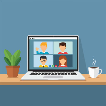 A laptop on a desk with cartoon people on screen
