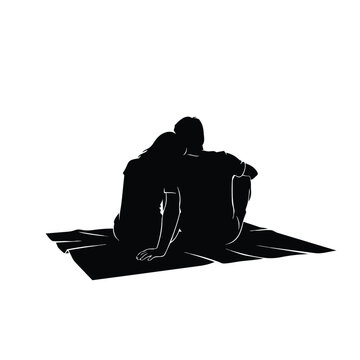 Couple sitting together on a blanket against white silhouette