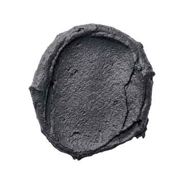 Charcoal mud face mask smear top view isolated. Skin care cosmetic product.