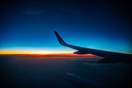 The wing of an airplane during flight